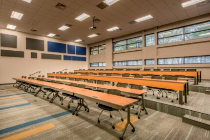 Tier linear lecture hall tables and Ty mobile multipurpose tables installed in a university classroom